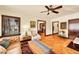 Cozy living room with wood floors, large window, and doorway to dining area at 963 N Logan St # 2, Denver, CO 80203