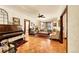 Bright living room featuring parquet wood flooring and large windows for natural light at 963 N Logan St # 2, Denver, CO 80203