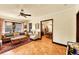 Living room with wood floors, ceiling fan, and an open layout to the dining area at 963 N Logan St # 2, Denver, CO 80203