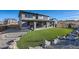 Well-manicured backyard features a lush lawn, patio area, and gravel path at 14209 Beebalm Loop, Parker, CO 80134
