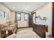Cozy Bedroom with a crib, changing table, and soft carpet at 14209 Beebalm Loop, Parker, CO 80134