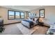 Bright bedroom with large windows, stylish decor, and comfortable furnishings at 14209 Beebalm Loop, Parker, CO 80134