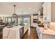 Bright kitchen showcasing a spacious island, stainless steel appliances, and access to the backyard at 14209 Beebalm Loop, Parker, CO 80134