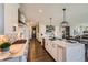 Spacious kitchen featuring a large island, white cabinetry, and modern stainless steel appliances at 14209 Beebalm Loop, Parker, CO 80134