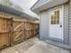 Private backyard access with a wooden gate and walkway, enhancing outdoor living at 1932 S Oswego Way, Aurora, CO 80014