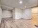 Spacious basement area with modern flooring and neutral paint, ready for customization at 1932 S Oswego Way, Aurora, CO 80014