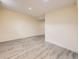 Spacious basement with wood-look flooring at 1932 S Oswego Way, Aurora, CO 80014