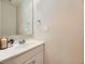 Bathroom with mirror and sink with vanity at 1932 S Oswego Way, Aurora, CO 80014