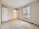 Neutral bedroom with window and carpet and closet at 1932 S Oswego Way, Aurora, CO 80014