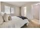 Bright bedroom with window and en-suite bathroom at 1932 S Oswego Way, Aurora, CO 80014