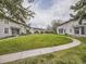 Well-maintained community lawn area with walkways between residential buildings at 1932 S Oswego Way, Aurora, CO 80014
