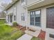 Up close of the front entry of the townhomes showing well-maintained landscaping at 1932 S Oswego Way, Aurora, CO 80014