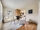 Comfortable living room showcasing hardwood floors, stone fireplace, and neutral decor at 1932 S Oswego Way, Aurora, CO 80014
