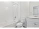 Well-lit bathroom featuring a shower-tub combination and modern fixtures at 6902 Huddersfield Ln, Castle Pines, CO 80108
