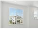 Bright bedroom with large windows offering neighborhood views at 6902 Huddersfield Ln, Castle Pines, CO 80108
