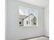 Bright bedroom with a view, featuring a large window and neutral tones at 6902 Huddersfield Ln, Castle Pines, CO 80108