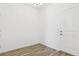 A dining room with hardwood floor, a light fixture, and a white door at 6902 Huddersfield Ln, Castle Pines, CO 80108