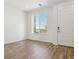 Bright entryway with beautiful wood-look floors and a large window at 6902 Huddersfield Ln, Castle Pines, CO 80108