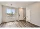 Entryway with modern flooring, ample natural light, and access to the upper level at 6902 Huddersfield Ln, Castle Pines, CO 80108