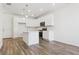 Modern kitchen featuring white cabinets, stainless steel appliances, and an island at 6902 Huddersfield Ln, Castle Pines, CO 80108