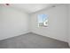 Serene bedroom with soft carpet, a large window, and ample natural light at 1368 Penner Dr, Erie, CO 80026