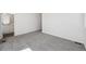 This bedroom is naturally well-lit and has neutral carpeting and an adjoining bathroom at 1368 Penner Dr, Erie, CO 80026