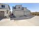 The exterior of this home features a two car garage, landscaping, and modern siding at 1368 Penner Dr, Erie, CO 80026