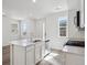 Bright kitchen features a center island, stainless steel appliances, and ample counter space at 1368 Penner Dr, Erie, CO 80026