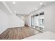 Spacious living room area with hardwood flooring and sliding glass doors leading to a private patio at 1368 Penner Dr, Erie, CO 80026