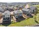 Expansive aerial view showcases the home's backyard with a patio, mature trees, and the surrounding neighborhood at 3727 Starry Night Loop, Castle Rock, CO 80109