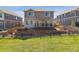 A backyard with a deck and tiered landscaping at 3727 Starry Night Loop, Castle Rock, CO 80109