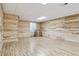 The spacious basement has wood-look floors, accent walls and a window with natural light at 3727 Starry Night Loop, Castle Rock, CO 80109