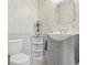 This bathroom has a pedestal sink, modern fixtures and a corner shelf at 3727 Starry Night Loop, Castle Rock, CO 80109