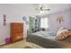 A bedroom features a large dresser and bed with gray and decorative pillows at 3727 Starry Night Loop, Castle Rock, CO 80109