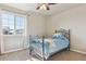 A cozy bedroom featuring a large window and carpeting at 3727 Starry Night Loop, Castle Rock, CO 80109