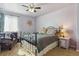 Bedroom features a bed, sitting chair, side table and natural light at 3727 Starry Night Loop, Castle Rock, CO 80109