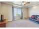 Bright and spacious bedroom with a window, ceiling fan, and neutral decor with a modern futon at 3727 Starry Night Loop, Castle Rock, CO 80109