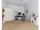 Light-filled bedroom with a functional workspace, neutral carpet, and a view into the home at 3727 Starry Night Loop, Castle Rock, CO 80109