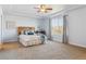 Serene bedroom with a large window, plush carpet, and comfortable queen bed with stylish decor, bright window at 3727 Starry Night Loop, Castle Rock, CO 80109