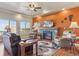 Inviting living room features a stone fireplace, plush seating, and bright windows offering great views at 3727 Starry Night Loop, Castle Rock, CO 80109