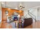 Comfortable living room featuring a stone fireplace, cozy seating, and stylish decor with staircase nearby at 3727 Starry Night Loop, Castle Rock, CO 80109