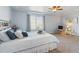 This main bedroom features a large window, neutral carpeting, and a ceiling fan at 3727 Starry Night Loop, Castle Rock, CO 80109