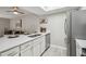 Modern kitchen featuring white cabinets, stainless steel appliances, and a sleek quartz countertop with bar seating at 4274 S Salida Way # 6, Aurora, CO 80013