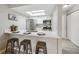 Bright kitchen featuring stainless steel appliances, white cabinetry, and a modern quartz countertop with bar seating at 4274 S Salida Way # 6, Aurora, CO 80013