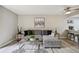 Inviting living room with a comfortable gray couch, contemporary decor, and seamless connection to the kitchen at 4274 S Salida Way # 6, Aurora, CO 80013