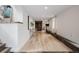 Finished basement area showcasing an exercise bike and hardwood floors at 7869 S Turkey Creek Rd, Morrison, CO 80465