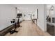 Finished basement area featuring an exercise bike, desk, and sleeping area at 7869 S Turkey Creek Rd, Morrison, CO 80465