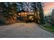 Charming home exterior featuring dark siding, large windows, and natural surroundings at 7869 S Turkey Creek Rd, Morrison, CO 80465