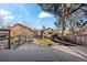 A backyard with a wooden deck and a well-maintained lawn, surrounded by a wooden fence at 2222 Irving St, Denver, CO 80211