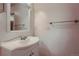 Clean bathroom with a vanity, mirror, and towel bar at 6594 W Mississippi Way, Lakewood, CO 80232